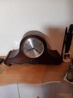 Antieke klik pendule, Ophalen