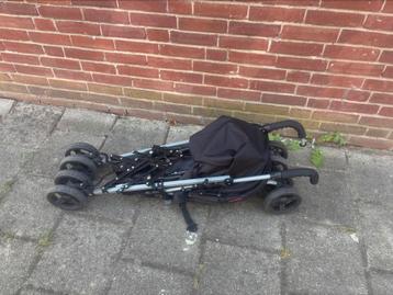zwarte buggy van het merk Topmark beschikbaar voor biedingen