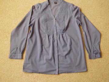Blauwe blouse beschikbaar voor biedingen
