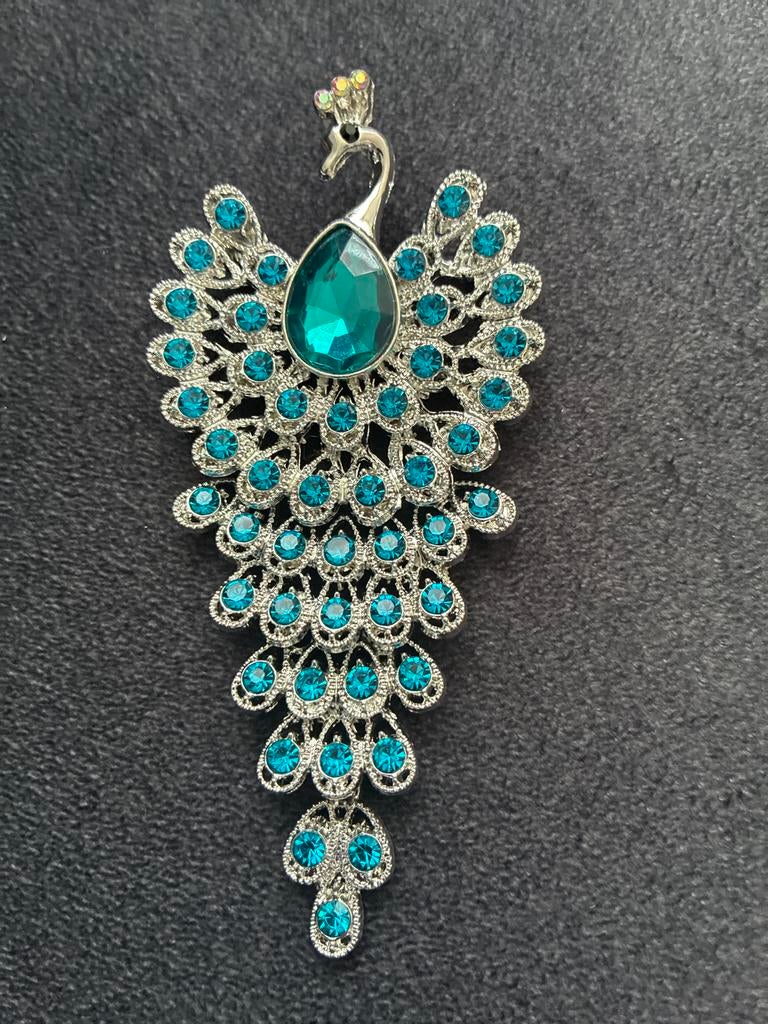 Elegante Pauw Broche met Turkoois Kristallen, Met kristal, Overige materialen, Ophalen of Verzenden, Zo goed als nieuw