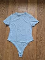 Lichtblauwe body maat 42/44, Kleding | Dames, Maat 42/44 (L), Ophalen of Verzenden, Zo goed als nieuw, Korte mouw