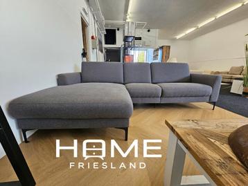 Grijze hoekbank met chaise longue beschikbaar voor biedingen