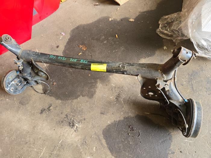 Achteras voorwielaandrijving van een Toyota Aygo, Auto-onderdelen, Remmen en Aandrijving, Gebruikt, 3 maanden garantie