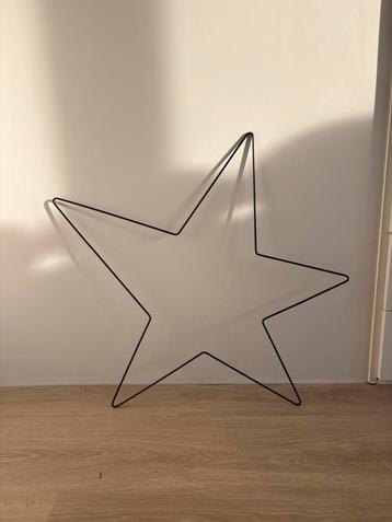 Decoratieve metalen ster beschikbaar voor biedingen
