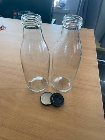 Set van 2 glazen literflessen beschikbaar voor biedingen