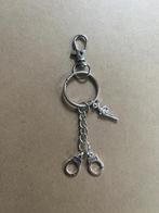 Sleutelhanger 2 handboeien en een pistool met musketonhaak, Verzamelen, Ophalen of Verzenden, Nieuw, Overige typen