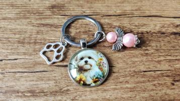 Sleutelhanger Maltezer cabochon met beschermengeltje beschikbaar voor biedingen