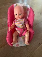 Babypop in roze draagstoel, Ophalen of Verzenden, Zo goed als nieuw, Babypop
