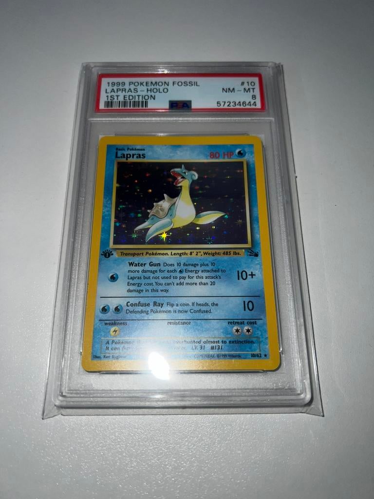 PSA 8 Pokémon Fossil Lapras 1st Ed., Ophalen of Verzenden, Zo goed als nieuw