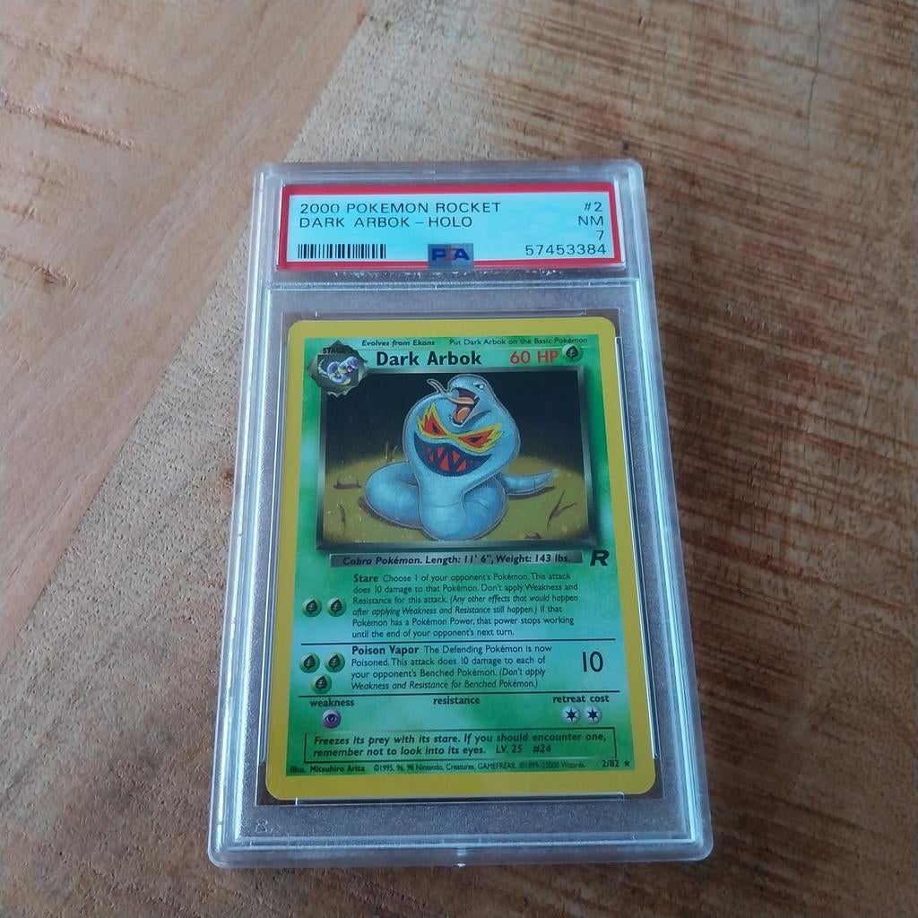 PSA 7 NM Dark Arbok Holo 2000 Pokemon Rocket, Ophalen of Verzenden, Zo goed als nieuw, Losse kaart