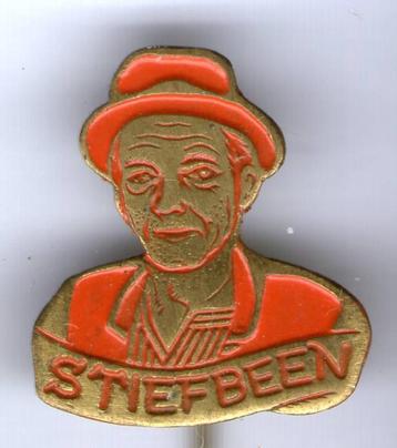 Stiefbeen oranje op koper tv serie speldje ( S_204 ) beschikbaar voor biedingen