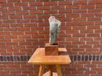 Beeld van steen Torso., Ophalen