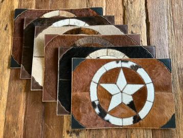 Koeienhuid placemats beschikbaar voor biedingen