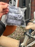 Nieuwe mooi bobike mini kinderfietsstoel (beige/ brown), Fietsen en Brommers, Fietsaccessoires | Fietsstoeltjes, Ophalen, Voetsteuntjes