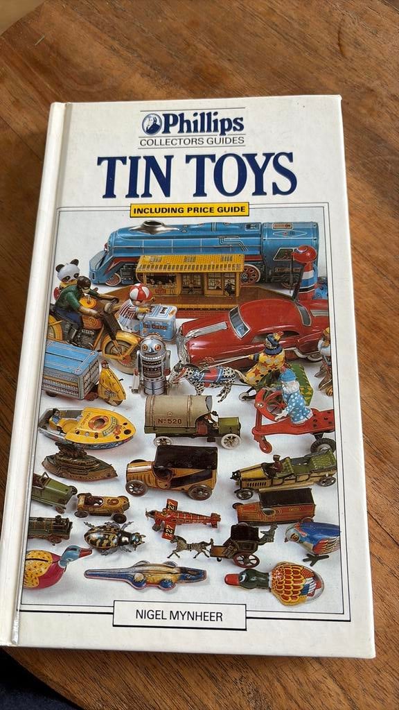 Boek over blikken speelgoed auto disney trein dieren, Ophalen of Verzenden