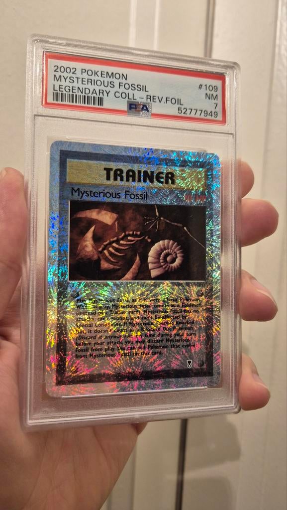 Mysterious Fossil 109/110 graded PSA 7, Ophalen of Verzenden, Gebruikt, Losse kaart, Foil
