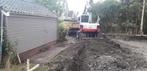 Tuin afgraven en afvoeren. Knijperauto