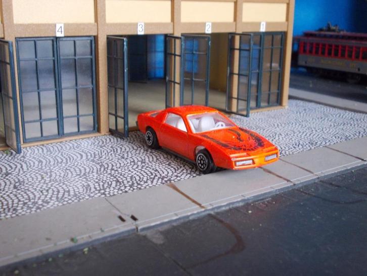 1982 Pontiac Firebird - oranje, Hobby en Vrije tijd, Modelauto's | Overige schalen, Gebruikt, Ophalen of Verzenden