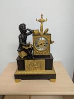 Bronzen pendule met touwslinger, Ophalen