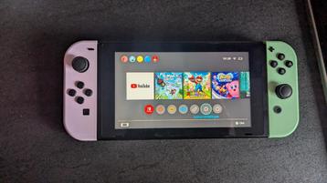 Nintendo Switch Groen & Roze (zo goed als nieuw) + accessoir beschikbaar voor biedingen