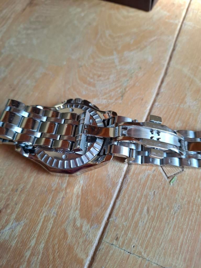 Mercury Polshorloge met stalen band en zwarte wijzerplaat, Sieraden, Tassen en Uiterlijk, Horloges | Heren, Ophalen of Verzenden