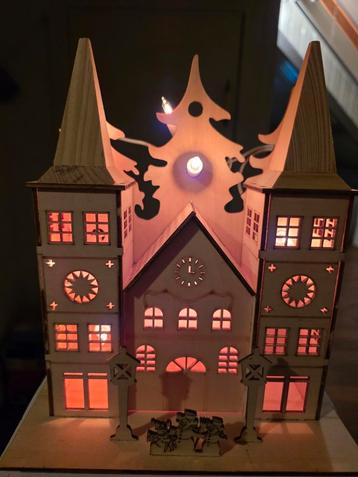 Kerst huisje met lichtjes beschikbaar voor biedingen