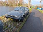 Toyota Carina 1.6 XL K6 1989 Grijs, Auto's, Voorwielaandrijving, Carina, 4 cilinders, Origineel Nederlands