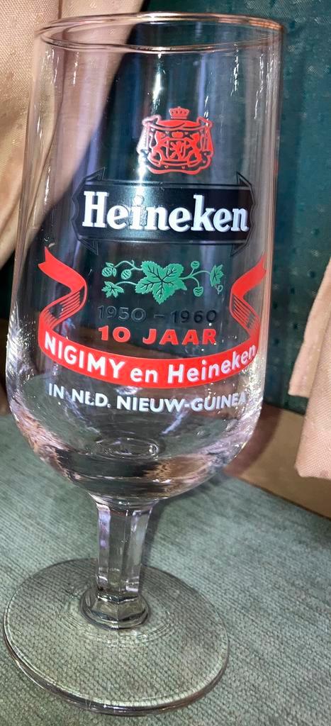 Heineken 1950 1960 10 jaar Nigimy Heineken Ndl. Nieuw Guinea, Verzamelen, Biermerken, Zo goed als nieuw, Glas of Glazen, Heineken