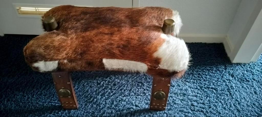 Voetenbankje., Ophalen