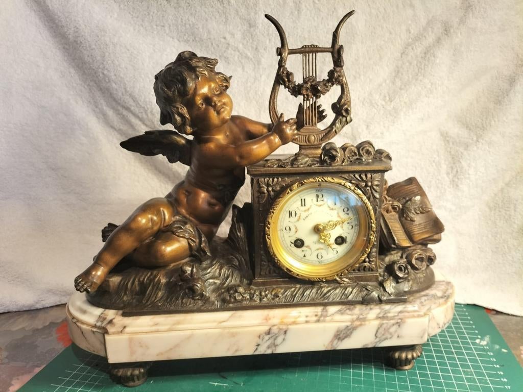 Pendule met engeltje en harp, Ophalen