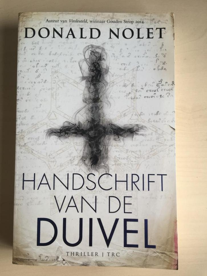 Handschrift van de Duivel - Donald Nolet, Boeken, Thrillers, Zo goed als nieuw, Nederland, Ophalen of Verzenden