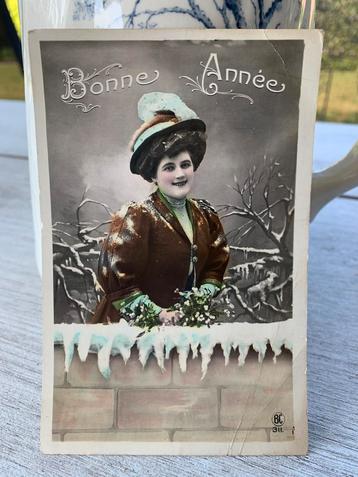 Bonne Année - Dame met mistletoe in de sneeuw beschikbaar voor biedingen
