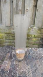 Hoge glazen vaas, Ophalen