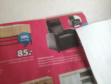 zwarte stoffen hoes voor over getoonde fauteuil