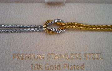 Armband met liefdesknoop in goud/zilver beschikbaar voor biedingen