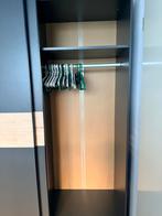 Kledingkast Genua Leen Bakker - Zwart/Eiken, Huis en Inrichting, Kasten | Kledingkasten, Ophalen, Met plank(en), 100 tot 150 cm