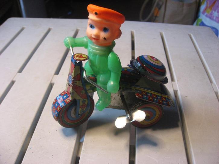 Blikken speelgoed driewieler met poppetje, Antiek en Kunst, Antiek | Speelgoed, Ophalen of Verzenden