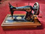 Oude Singer naaimachine, Ophalen