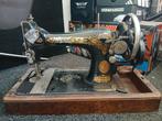 Antieke naaimachine, Ophalen