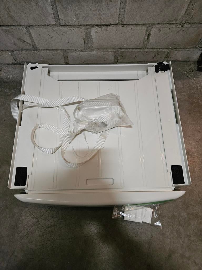 Uitschuifbaar tussenstuk voor droger op wasmachine, Ophalen