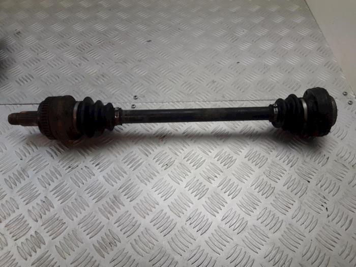 Aandrijfas links-achter van een BMW 1-Serie, Auto-onderdelen, Remmen en Aandrijving, BMW, Gebruikt, 3 maanden garantie, Ophalen of Verzenden