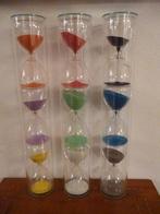 Nieuw glazen cilinder met gekleurde zandlopers Fidrio glass., Ophalen of Verzenden