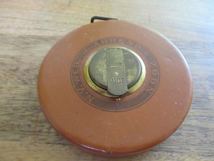 J.Ahrend & Zoon vintage meetlint 10 meter NV.Wed., Doe-het-zelf en Verbouw, Meetapparatuur, Gebruikt, Afstand, Ophalen of Verzenden