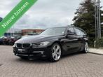 BMW 3-serie Touring 328i Upgrade Edition, Leer, Pano, Xenon!, 4 cilinders, Zwart, Handgeschakeld, 1600 kg