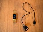 Fitbit Charge 4 - Gouden band, Zwart, Ophalen of Verzenden, Zo goed als nieuw, Waterdicht