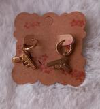 Gouden pistool oorbellen, Overige materialen, Hangers, Nieuw, Ophalen of Verzenden