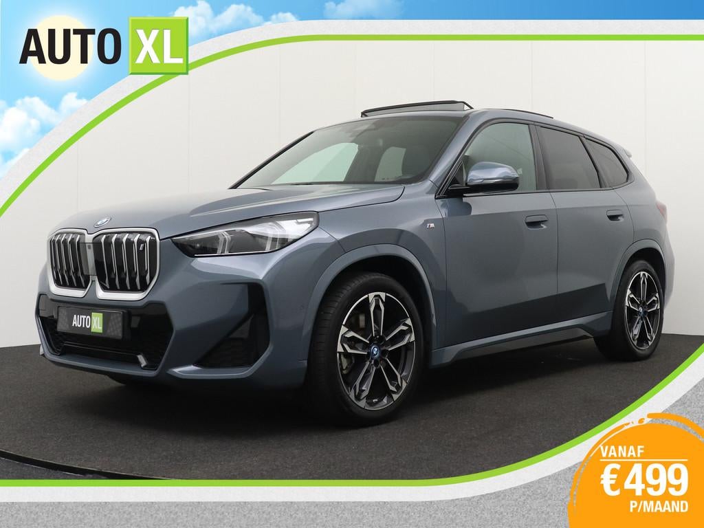BMW iX1 xDrive30 67 kWh (98%SOH) 313 PK M-sport+ Pano-Dak Ca, Auto's, BMW, Automaat, Gebruikt, Zwart, Lichtsensor