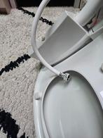 Toiletbril met water, Ophalen