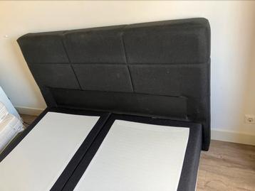 2-person bed with a headboard