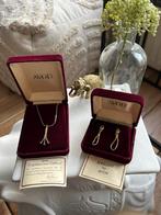 Vintage sieraden van Avon. 18kt verguld met echte robijnen, Ophalen of Verzenden, Goud, Verguld